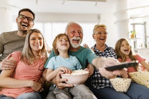 seniors watch a movie with the whole family